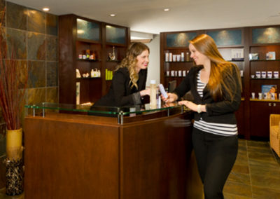 Woman purchases products at hotel spa