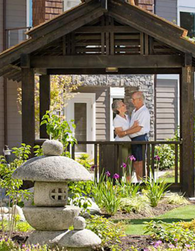 Older couple enjoys a nice moment outside under covered garden space