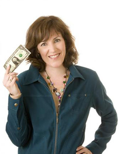 Woman poses with American currency with white background in studio