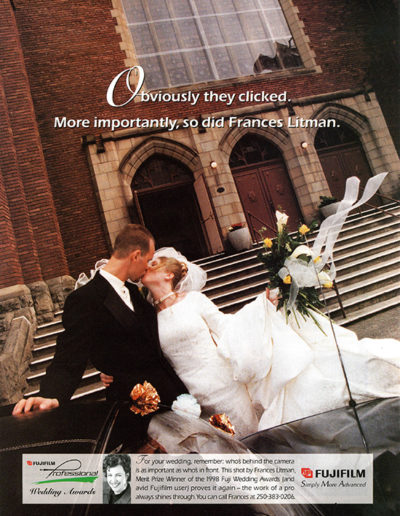 Award winning wedding couple photo outside church exterior with wind blowing